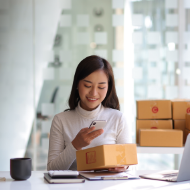 Woman scanning a label on a box